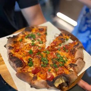 a pizza being served