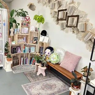 Book wall, books, used books, stickers, plants