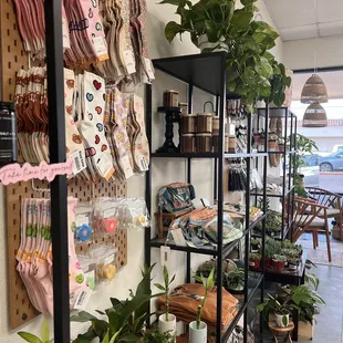 Sock wall by shelves filled with goodies