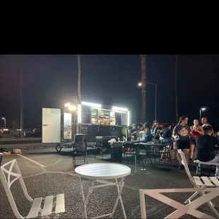 a group of people sitting at tables