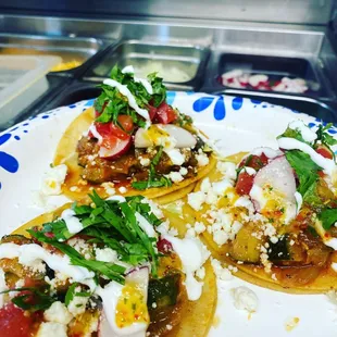 three tacos on a plate