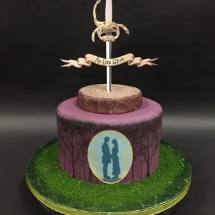 a cake with a sword on top