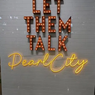 a neon sign that says pearl city