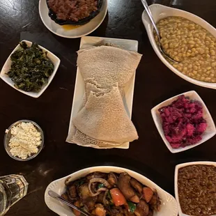 Injera, Yemisir Wot, Asa Tibs, cottage cheese and collard greens for pairing with the kitfo, Kitfo, Kik Wot, Beet and Potato Salad
