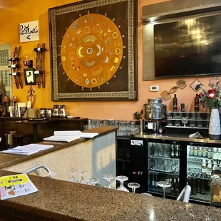 a bar with a clock on the wall