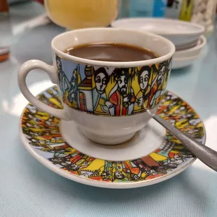 a cup of coffee on a saucer