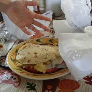 My take home order after driving home (5 min trip)! To emphasize how much grease was in my papa and egg taco en maize tortilla.