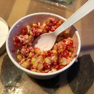 Elote in a cup with hot Cheetos  Both ladies are always very friendly when I order! Support your local businesses