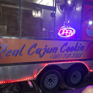 a food truck with neon lights
