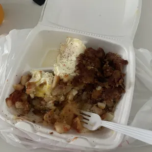 Corned beef hash with fries &amp; onions and my half eaten egg