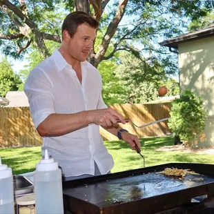 Some of us took turns attempting to crack an egg onto the hibachi spatula's edge over the grill. The eggs were scrambled &amp; fried.