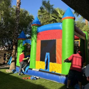 Crew settings up our bounce house