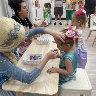 My daughter getting her make up done by Elsa!