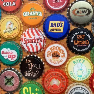 Decor is fun &amp; eclectic, like the groovy high tops that are covered in a fun bottle top collection