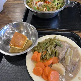 two plates of food on a tray