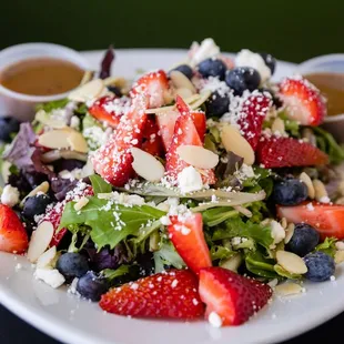 a salad with strawberries and blueberries