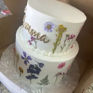 We chose almond flavor with raspberry and Bavarian cream filling, &amp; buttercream icing. Wildflower theme.