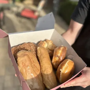 maple bar, chocolate glazed, original glazed, bear claw, and blueberry buttermilk