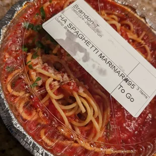 a plate of spaghetti and tomato sauce