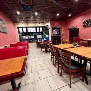 a dining area with a table and chairs