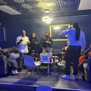 a group of people sitting around a table