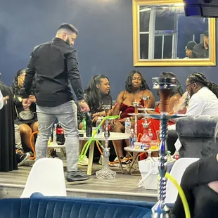 a group of people sitting at tables