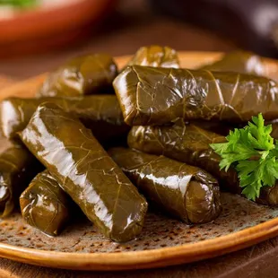 a plate of stuffed grape leaves