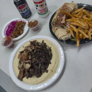 Hummus w half chicken and beef, two shawarma&apos;s with fries. Wonderful stuff!