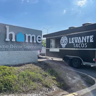 a truck parked in front of a building