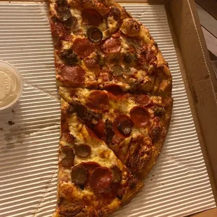 The Meats pizza, half eaten!