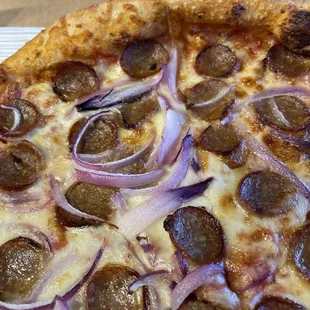 Create Your Own Pizza, large, with Italian sausage and red onions. Lookit all the toppings!