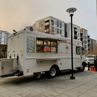 a food truck parked on a city street