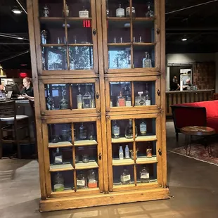 a display cabinet with glass doors
