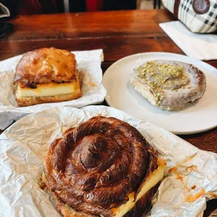 Breakfast Sammy on a croissant with baked egg and cheddar. London fog glazed twist (up right)