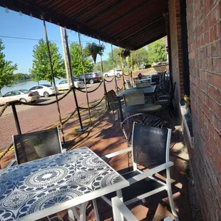 a patio with tables and chairs