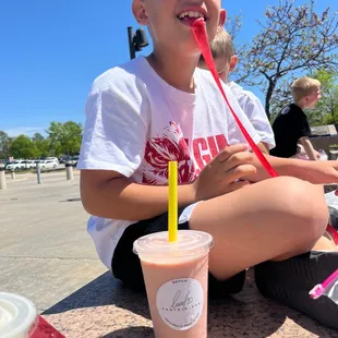 Eli my son enjoying his strawberry cheesecake shake made by Kat
