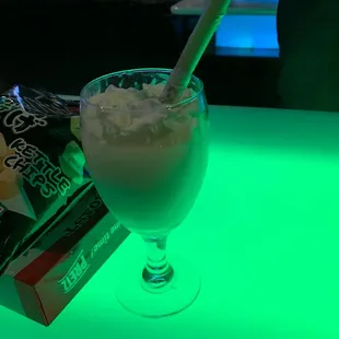 a drink in a glass with a straw