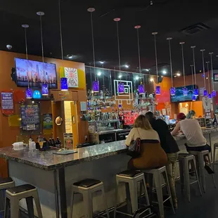people sitting at the bar