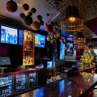 a bar with a christmas tree in the background