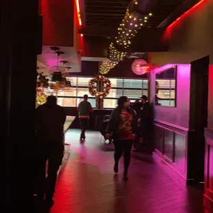 people walking through the bar