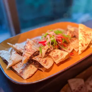 Short rib quesadilla with sides of salsa, crema, cilantro, and lime - 5/5 my fav