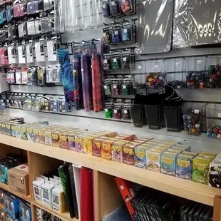 Deck boxes, card mats, tubes for card mat storage, dice trays, loose dice, inexpensive dice sets