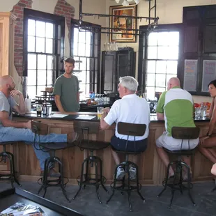 a group of people sitting at a bar