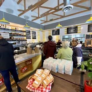 Walk in from the right, gaze at pastries, move to the left to grab a to-go order or continue on to place order at far left of counter.