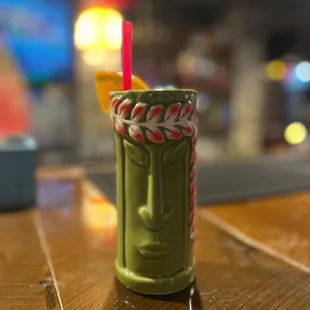 a drink in a tiki cup