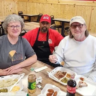 Owner Levy Smith with the first customers at grand opening