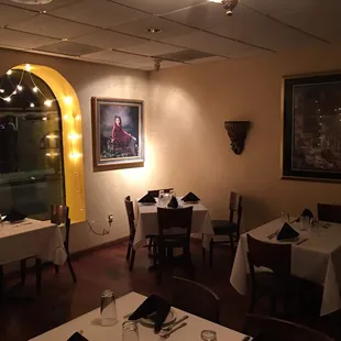 a dining room with tables and chairs