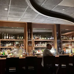people sitting at a bar