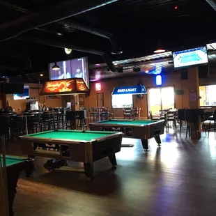 Bar side with pool tables &amp; stage for a band