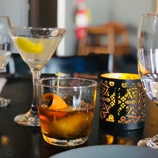 a table with glasses and a candle